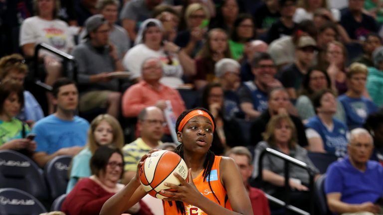Jonquel Jones in-bounds the ball during a Connecticut Sun game