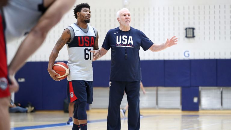 Team USA coach Gregg Popovich talks with Celtics guard Marcus Smart