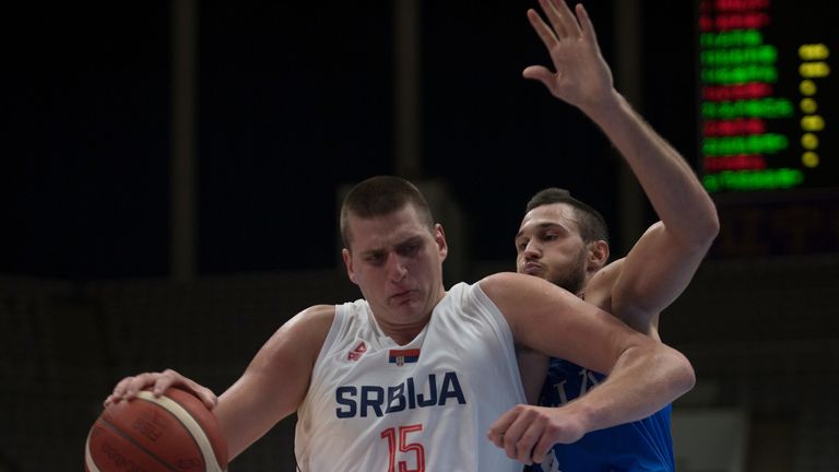 Nikola Jokic outmuscles a defender in Serbia's World Cup warm-up game against Italy
