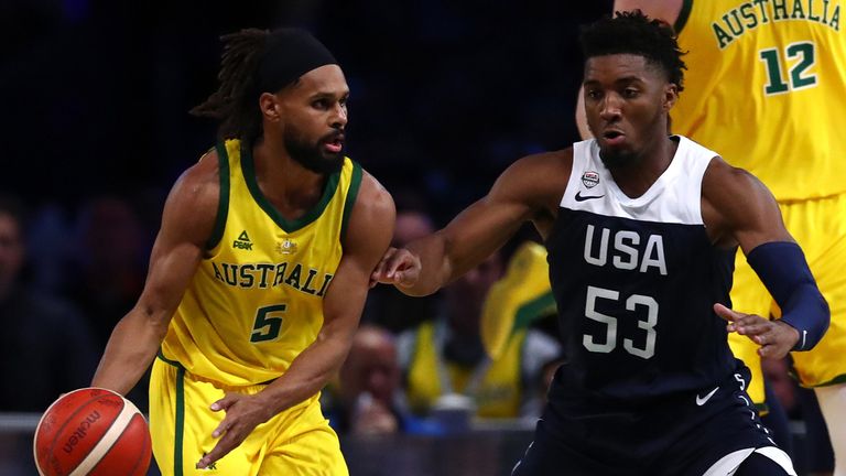 Patty Mills is guarded by Donovan MItchell