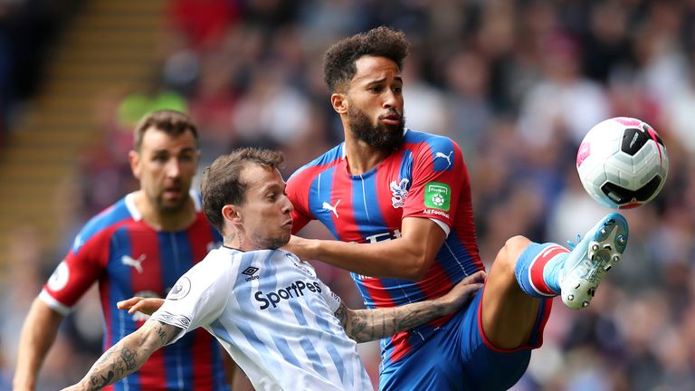 Andros Townsend is challenged by Bernard