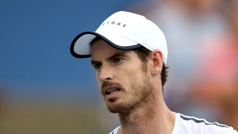 Andy Murray, playing with his brother Jamie Murray of Great Britain, looks on during their doubles match against Nicolas Mahut and Edouard Roger-Vasselin of France during Day 3 of the Citi Open
