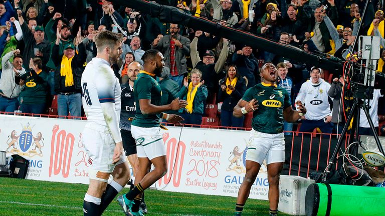 South Africa wing Aphiwe Dyantyi (right) celebrates after scoring against England