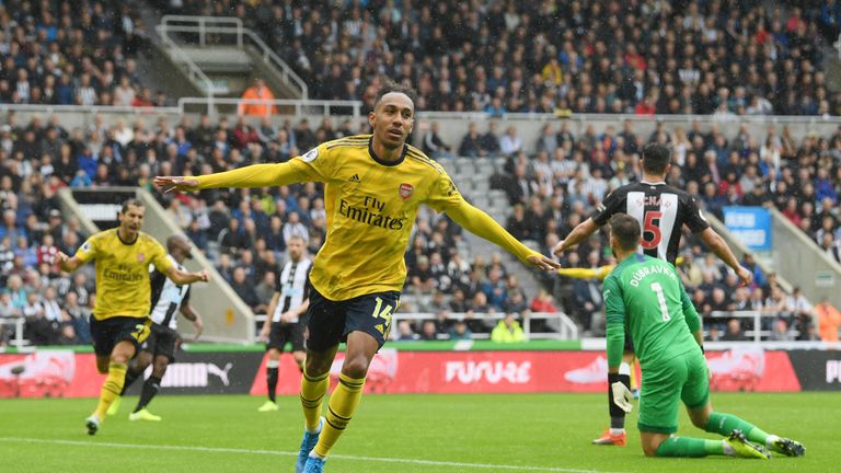 Pierre-Emerick Aubameyang celebrates opening the scoring for Arsenal at Newcastle