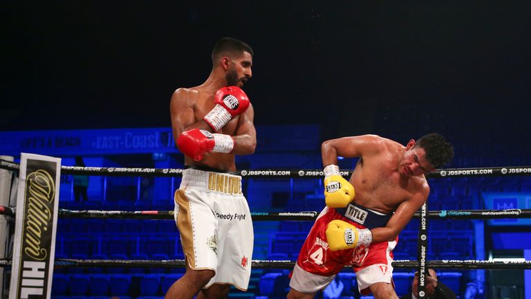 Atif Shqfiq catches Arturo Lopez with a left hook