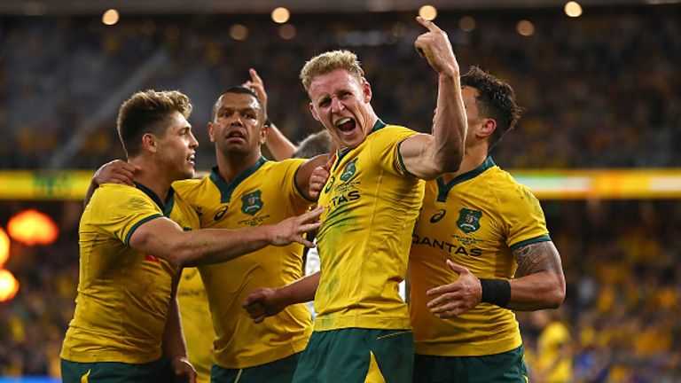 Reece Hodge celebrates scoring for the Wallabies against the world champions