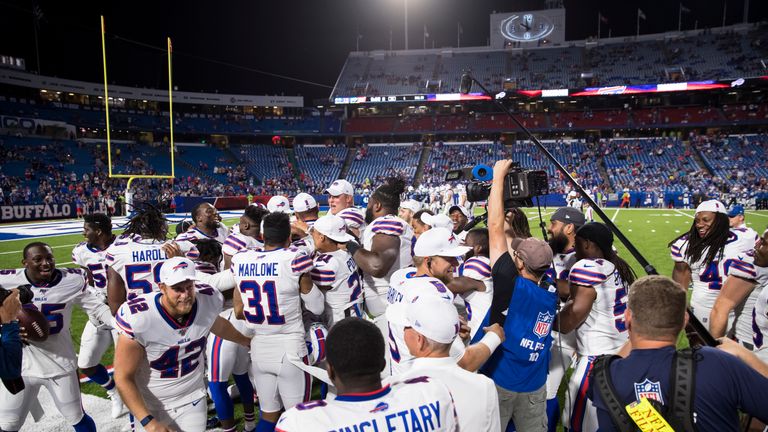 ORCHARD PARK, NY - AUGUST 08:  Christian Wade #45 of the Buffalo Bills is congratulated by teammates after carrying the ball for a touchdown during the fourth quarter of a preseason game against the Indianapolis Colts at New Era Field on August 8, 2019 in Orchard Park, New York. Buffalo defeats Indianapolis 24 -16.  (Photo by Brett Carlsen/Getty Images) *** Local Caption *** Christian Wade