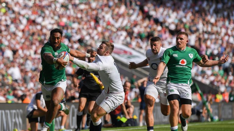  Bundee Aki holds off Elliot Daly to score a late Ireland consolation try