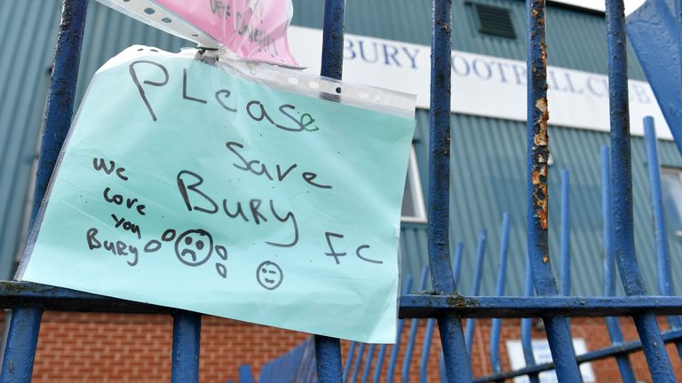 A note written by fans of Bury FC pinned to the gates at Gigg Lane