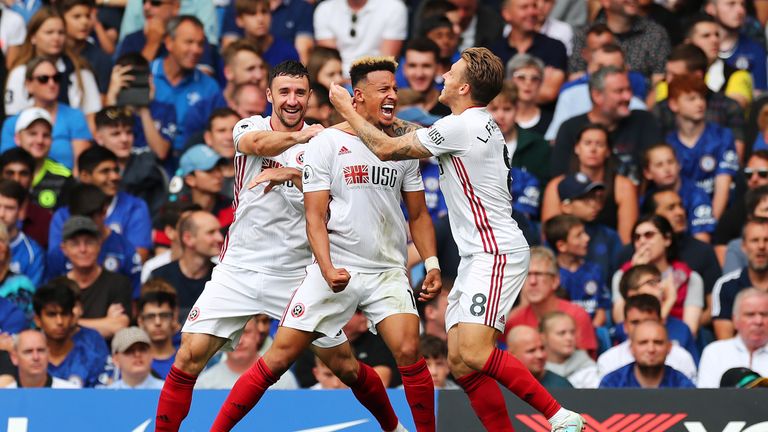 Callum Robinson celebrates at Stamford Bridge after reducing the deficit
