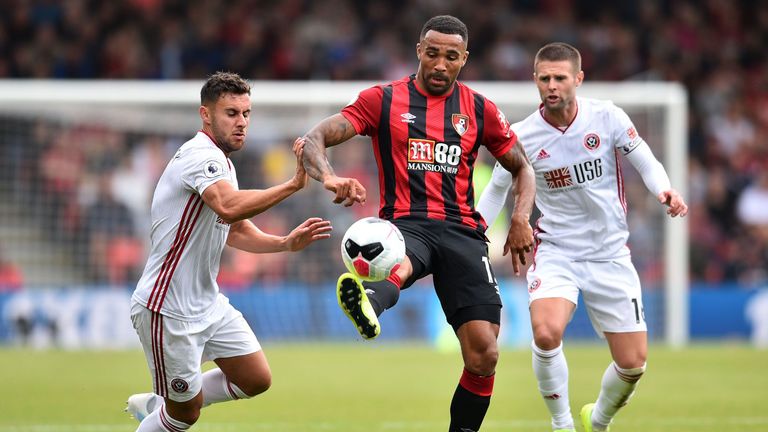 Callum Wilson is closed down by George Baldock (L) and Oliver Norwwod