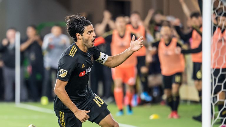 LOS ANGELES, CA - AUGUST 25:  Carlos Vela #10 of Los Angeles FC celebrates his goal during Los Angeles FC's MLS match against Los Angeles Galaxy at the Banc of California Stadium on August 25, 2019 in Los Angeles, California.  The match ended in a 3-3 draw.  (Photo by Shaun Clark/Getty Images) *** Local Caption *** Carlos Vela