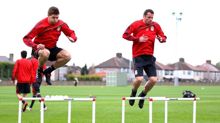 LIVERPOOL, ENGLAND - APRIL 28:  Steven Gerrard of Liverpool and team mate Jaime Carragher during a training session prior to the UEFA Europa League semi final second leg match between Liverpool and Athletico Madrid at Melwood training ground on April 28, 2010 in Liverpool, England.  (Photo by Clive Brunskill/Getty Images)