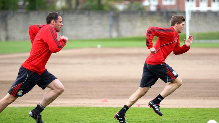 LIVERPOOL, ENGLAND - APRIL 28:  Steven Gerrard of Liverpool sprints away from team mate Jaime Carragher during a training session prior to the UEFA Europa League semi final second leg match between Liverpool and Athletico Madrid at Melwood training ground on April 28, 2010 in Liverpool, England.  (Photo by Clive Brunskill/Getty Images)