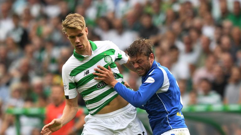 St Johnstone's Murray Davidson battles for the ball with Celtic defender Kristoffer Ajer