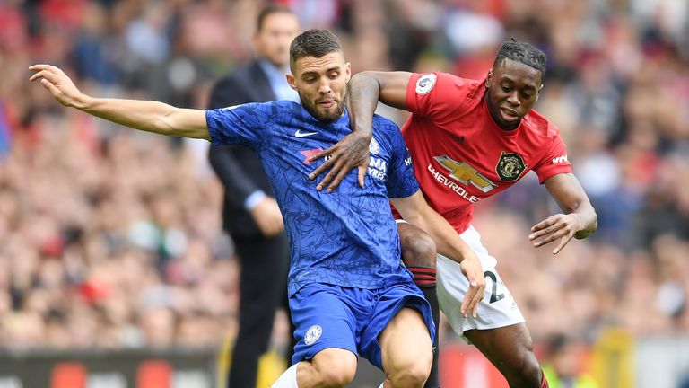 MANCHESTER, ENGLAND - AUGUST 11: Mateo Kovacic of Chelsea is challenged by Aaron Wan-Bissaka of Manchester United during the Premier League match between Manchester United and Chelsea FC at Old Trafford on August 11, 2019 in Manchester, United Kingdom. (Photo by Michael Regan/Getty Images)
