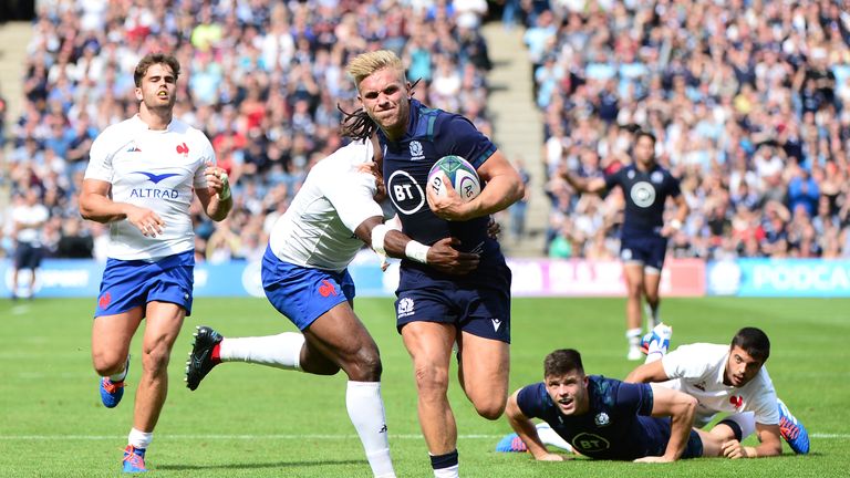 Chris Harris is tackled by Alivereti Raka during the Test at Murrayfield