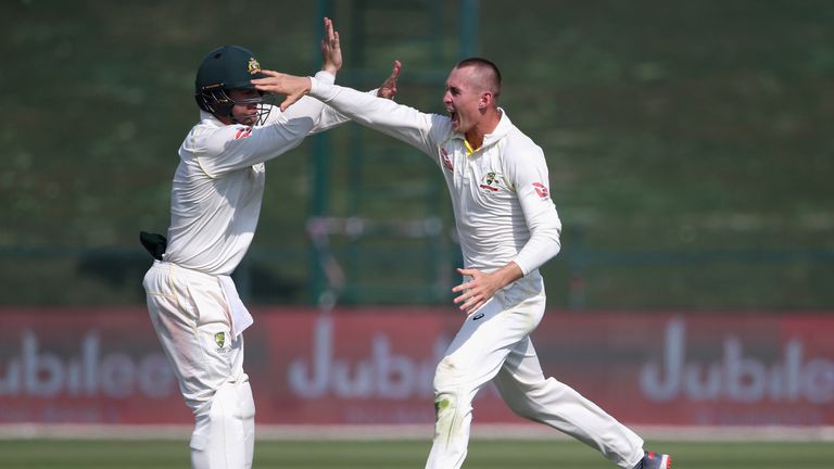 Marnus Labuschagne (right) celebrates a wicket with Asutralia team-mate Travis Head during the second Test against Pakistan in 2018