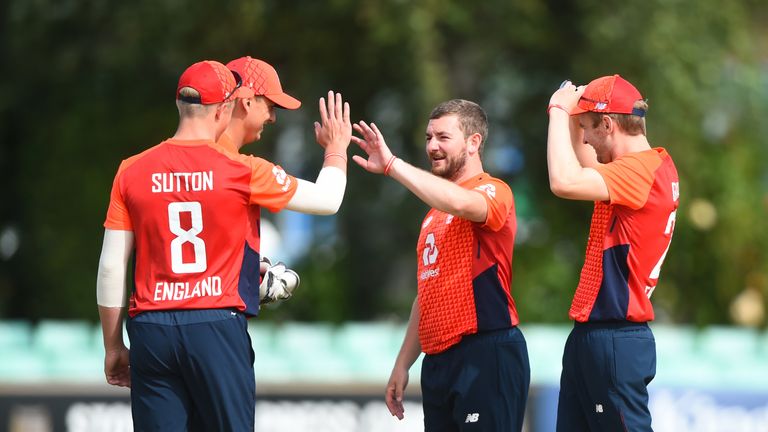 Callum Flynn (R) of England celebrates after taking a wicket during the Physical Disability World Series 2019 match against Rest Of The World XI at Worcester