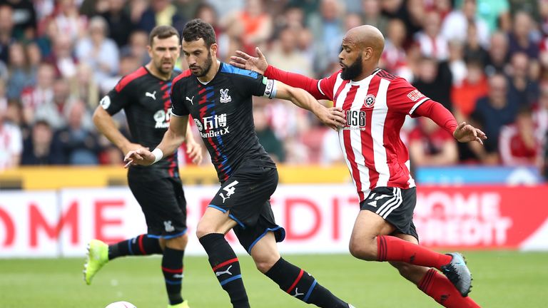 Crystal Palace's Luka Milivojevic (left) and Sheffield United's David McGoldrick battle for the ball during the Premier League match at Bramall Lane, Sheffield.