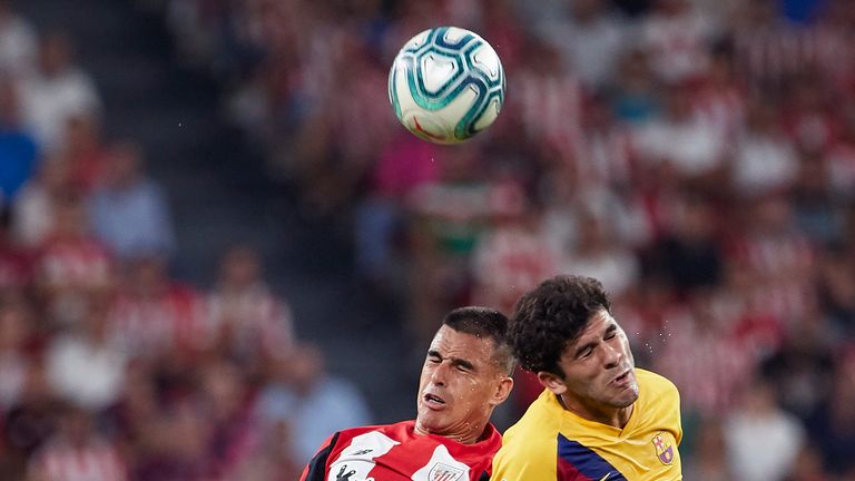 Dani Garcia of Athletic Bilbao competes for the ball with Barcelona's Carles Alena