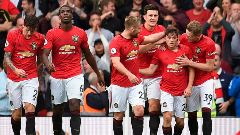 Manchester United&#39;s Daniel James (2nd R) celebrates with teammates after scoring their fourth goal on his Premier League debut during the match between Manchester United and Chelsea at Old Trafford in Manchester, north west England, on August 11, 2019. - Manchester United won the game 4--0.