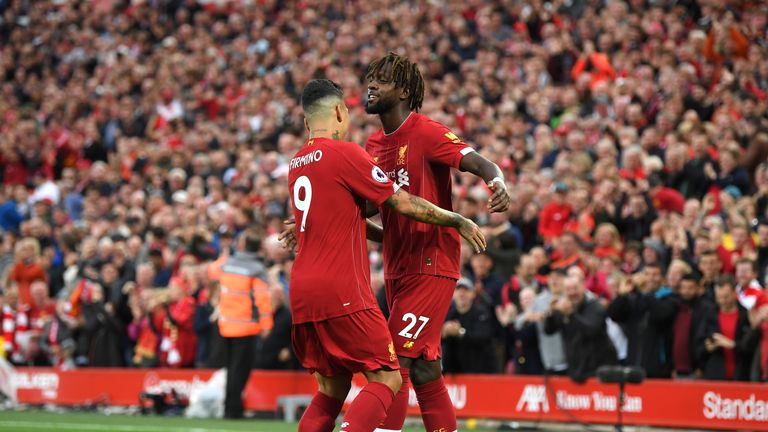 Divock Origi celebrates after his cross is deflected into the Norwich goal by Grant Hanley