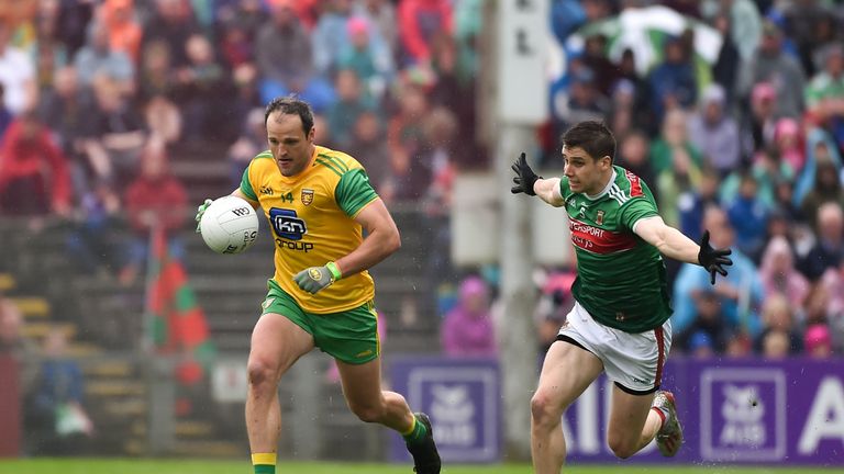 Michael Murphy of Donegal in action against Lee Keegan of Mayo