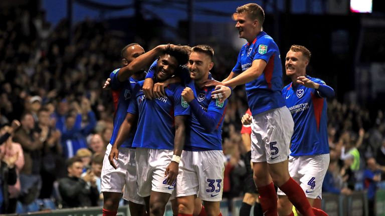 Portsmouth celebrate after Ellis Harrison makes it 3-0 against Birmingham