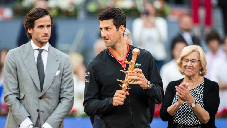 Tournament director Lopez watches on as Novak Djokovic celebrates his Madrid Open title in May 