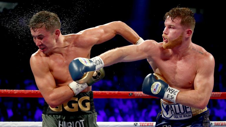 (L-R) Canelo Alvarez throws a punch at Gennady Golovkin during their WBC, WBA and IBF middleweight championionship bout at T-Mobile Arena on September 16, 2017 in Las Vegas, Nevada.