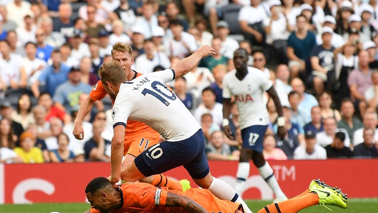 Harry Kane goes down in the penalty area under the challenge of Jamaal Lascelles, but VAR said no penalty