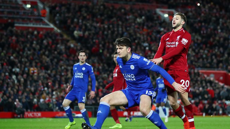 Harry Maguire and Adam Lallana during the Premier League match between Liverpool FC and Leicester City at Anfield on January 30, 2019 in Liverpool, United Kingdom.