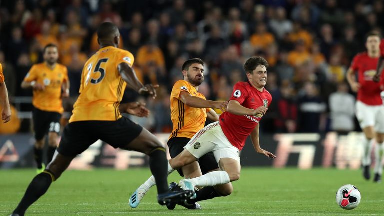 James is tackled by Wolves midfielder Ruben Neves