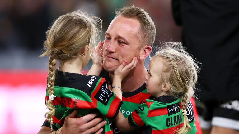 SYDNEY, AUSTRALIA - SEPTEMBER 15: Jason Clark of the Rabbitohs celebrates victory with his daughters during the NRL Semi Final match between the South Sydney Rabbitohs and the St George Illawarra Dragons at ANZ Stadium on September 15, 2018 in Sydney, Australia. (Photo by Mark Kolbe/Getty Images)