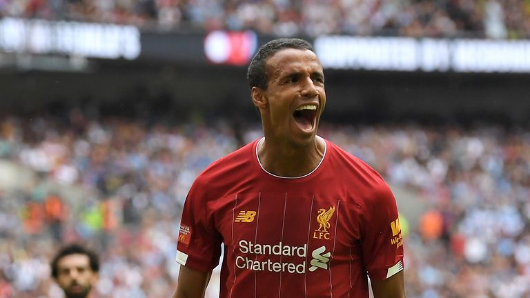 Joel Matip celebrates scoring for Liverpool against Manchester City