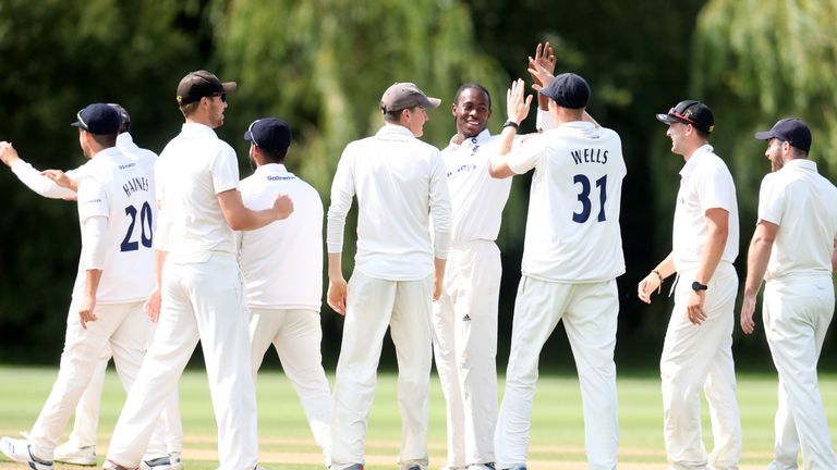 Sussex's Jofra Archer (centre) celebrates taking the first wicket of the innings against Gloucestershire 2nd XI