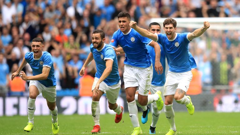 Manchester City celebrate winning the Community Shield against Liverpool on penalties