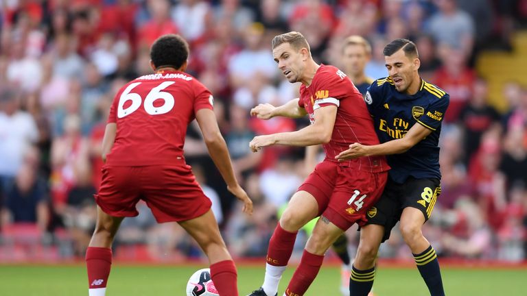 Arsenal's Dani Ceballos challenges Jordan Henderson of Liverpool