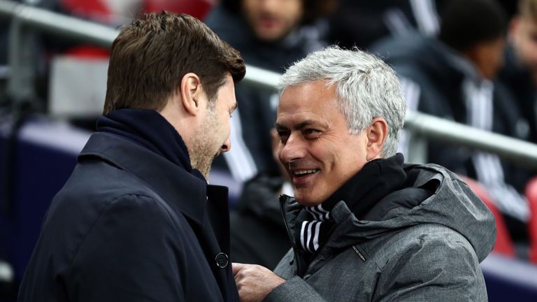 Jose Mourinho the head coach / manager of Manchester United is all smiles as he speaks with Mauricio Pochettino manager / head coach of Tottenham Hotspur before the Premier League match between Tottenham Hotspur and Manchester United at Wembley Stadium on January 31, 2018 in London, England. 