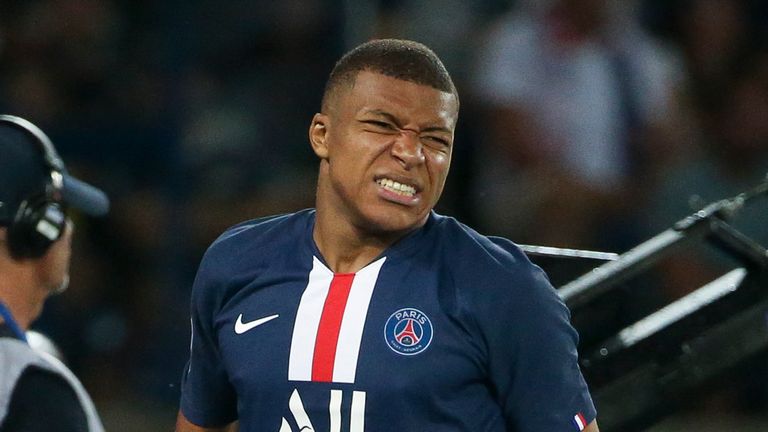 Kylian Mbappe winces after injuring his thigh against Toulouse