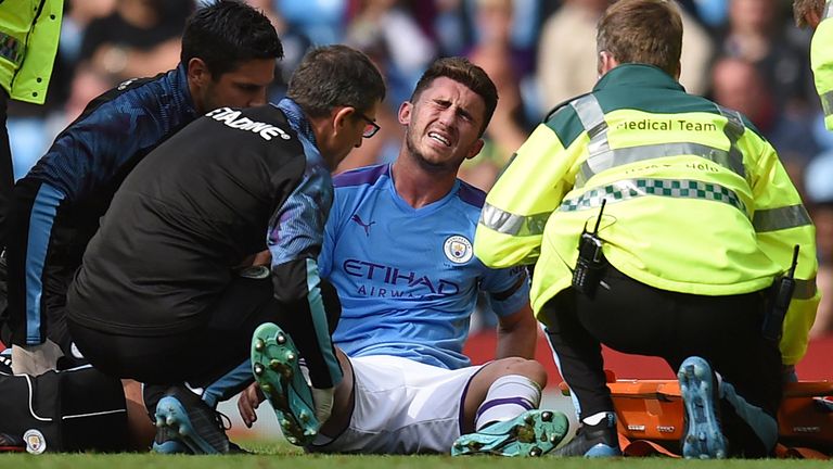 Aymeric Laporte gets treatment during Manchester City&#39;s game with Brighton.
