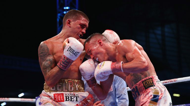 Lee Selby lands a shot on Josh Warrington during IBF Featherweight Championship fight at Elland Road on May 19, 2018 in Leeds, England.