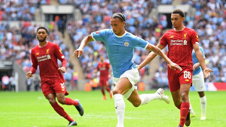 Leroy Sane runs with the ball for Manchester City against Liverpool