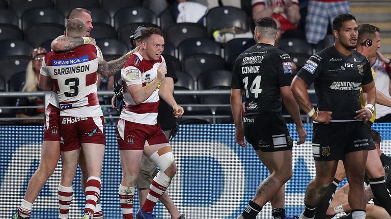 Wigan Warriors Liam Marshall celebrates scoring his second try