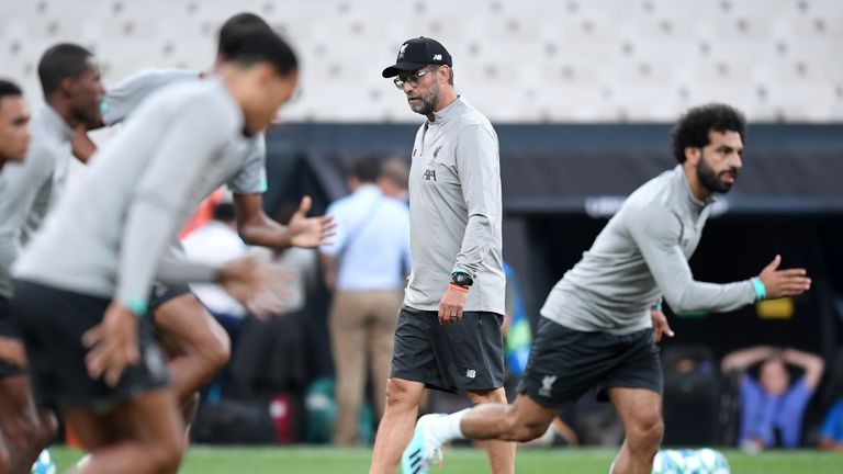 Jurgen Klopp watches on during a Liverpool training session ahead of the Super Cup