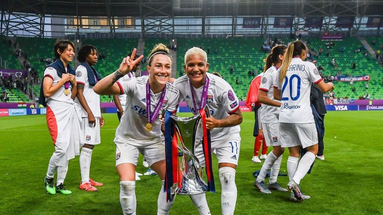 Lucy Bronze (left) celebrates winning last season's Women's Champions League