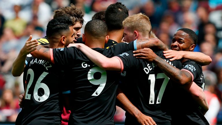 Manchester City&#39;s English midfielder Raheem Sterling (R) celebrates with team-mates after scoring their second goal during the English Premier League football match between West Ham United and Manchester City at The London Stadium, in east London on August 10, 2019.