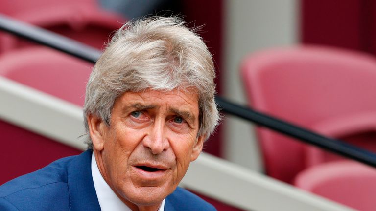 Manuel Pellegrini takes his seat prior to kick-off against Manchester City