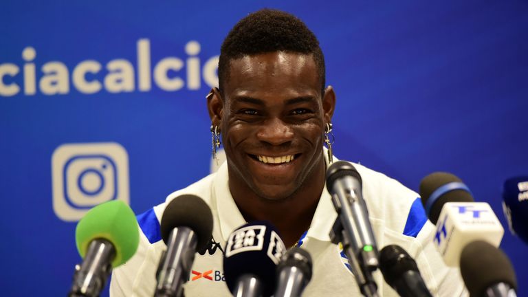 Mario Balotelli smiles during a press conference after signing with Serie A side Brescia